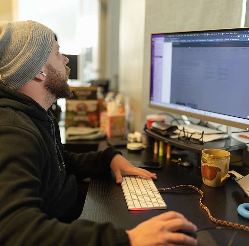 close-up of gentleman working on computer