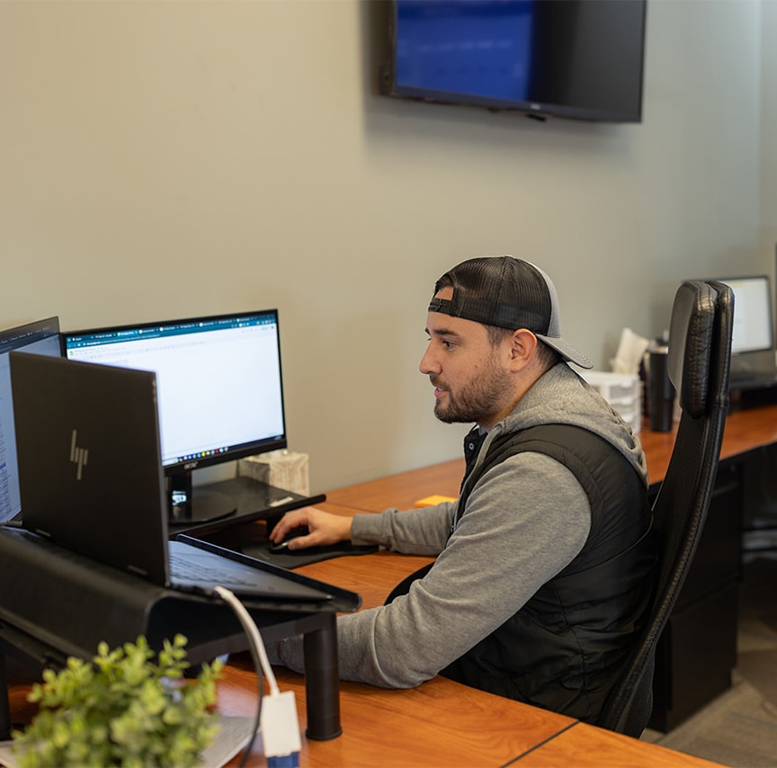 gentleman working on computer at his desk