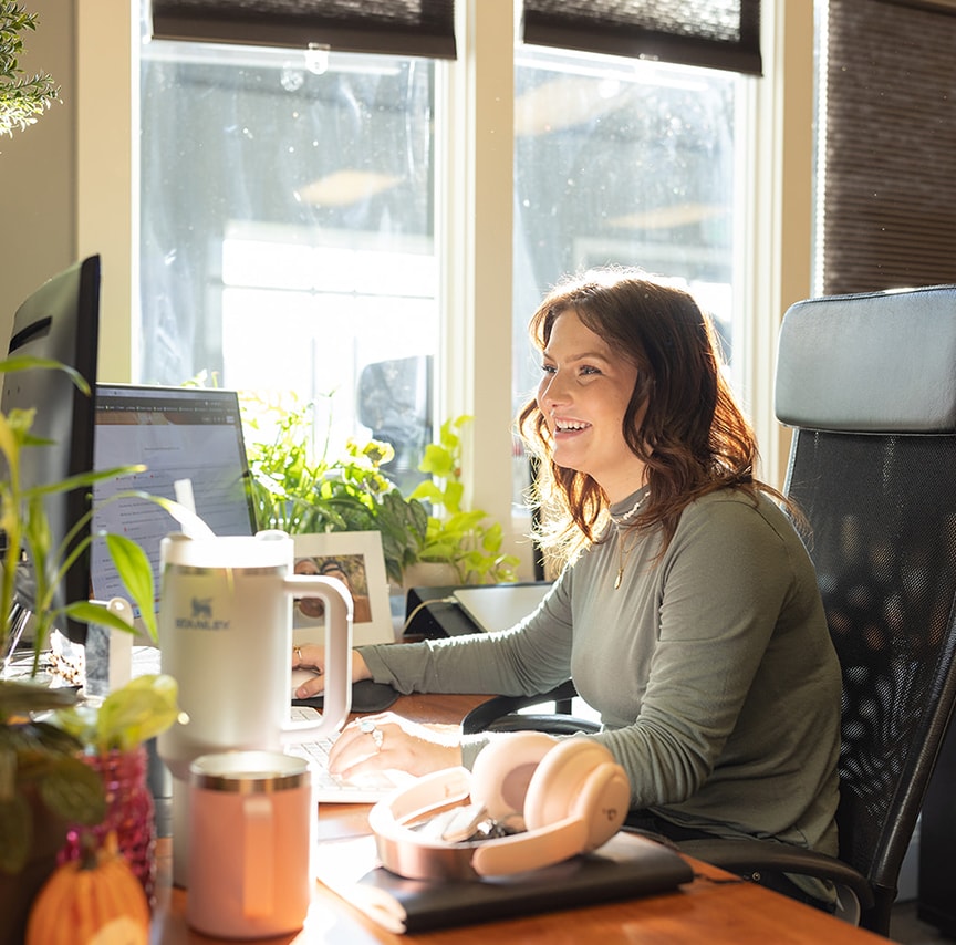 close-up of woman working at her desk in her office